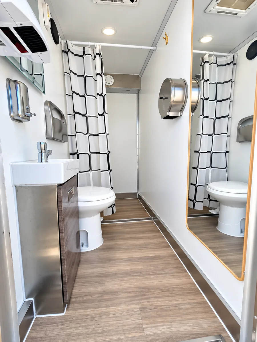 Supplied reference image labelled mobile luxury shower restroom trailer bathroom interior.