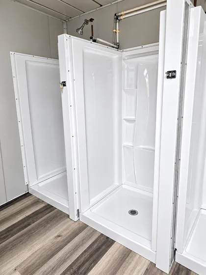 Supplied reference image labelled portable shower container multiple stalls.