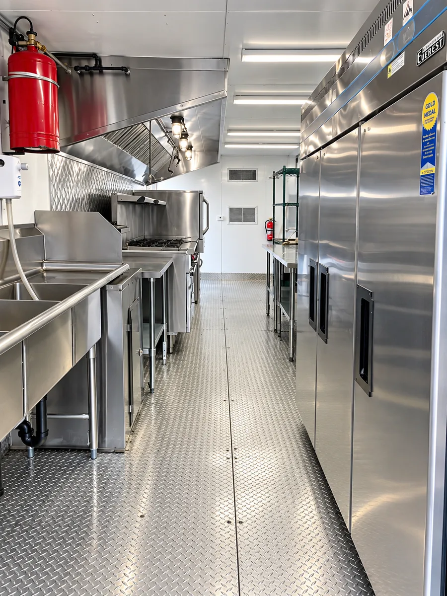 Supplied reference image labelled mobile kitchen trailer full equipment interior.