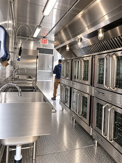 Supplied reference image labelled temporary kitchen trailer stainless steel cooking facility.