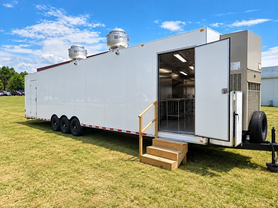 Supplied reference image labelled mobile commercial kitchen trailer exterior entrance.