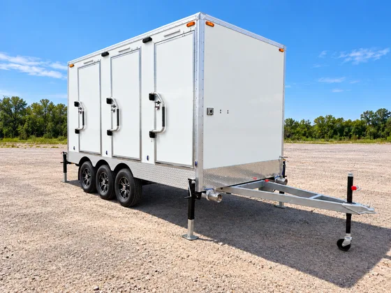 Supplied reference image labelled temporary luxury shower restroom combination trailer exterior.